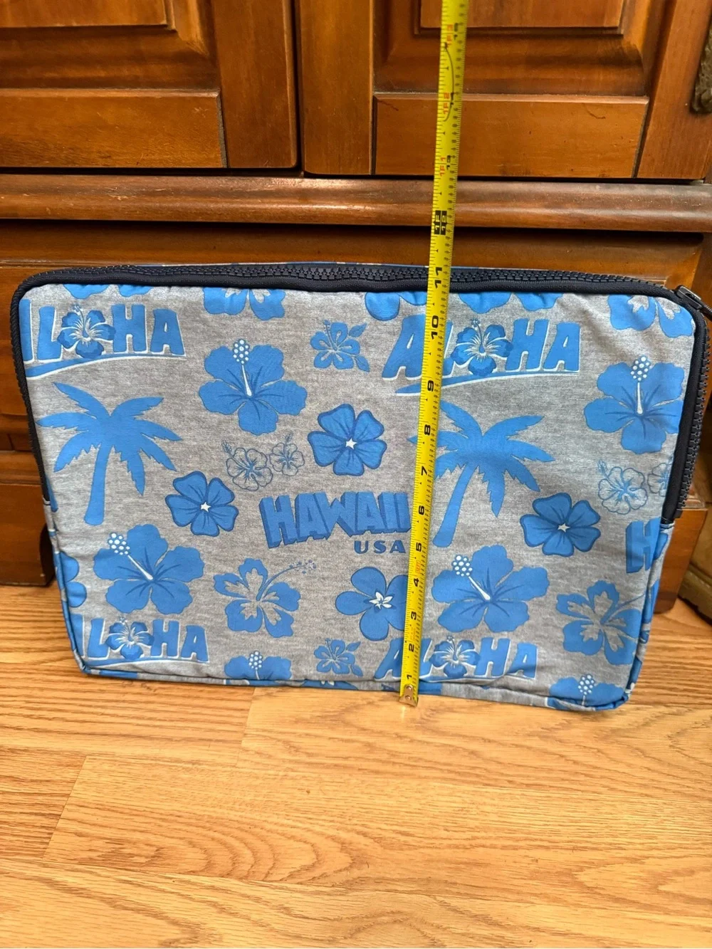LeSportsac brand travel pouch or laptop case featuring a blue and grey hibiscus